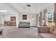 Open-concept living room with tile flooring and seamless flow into the dining area at 10414 N 105Th Ave, Sun City, AZ 85351