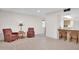 Inviting living room boasts tile flooring, cozy seating, and open layout to the kitchen at 10414 N 105Th Ave, Sun City, AZ 85351