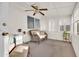 Relaxing sunroom featuring neutral decor, a ceiling fan, and abundant natural light at 10414 N 105Th Ave, Sun City, AZ 85351