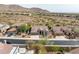 Stunning aerial view of the property showcasing the neighborhood, mountain views, and desert landscaping at 10819 E Butherus Drive --, Scottsdale, AZ 85255