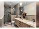 Modern bathroom with a glass-enclosed shower and a double-sink vanity at 10819 E Butherus Drive --, Scottsdale, AZ 85255