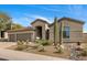 Stunning home exterior with a three car garage and desert landscaping at 10819 E Butherus Drive --, Scottsdale, AZ 85255