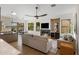 Modern living room with fireplace, TV and neutral decor with access to outdoor dining area at 10819 E Butherus Drive --, Scottsdale, AZ 85255