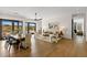 Open-concept living and dining area with light wood floors and plenty of natural light at 10819 E Butherus Drive --, Scottsdale, AZ 85255