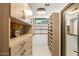 Spacious walk-in closet with custom shelving and ample storage space at 10819 E Butherus Drive --, Scottsdale, AZ 85255