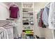 Organized walk-in closet with built-in shelving and ample hanging space at 11034 E Natal Ave, Mesa, AZ 85209