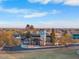 The well-maintained clubhouse surrounded by lush landscaping and blue skies at 11034 E Natal Ave, Mesa, AZ 85209