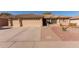 Charming single-story home featuring a three-car garage and a well-maintained desert landscaped front yard at 11034 E Natal Ave, Mesa, AZ 85209
