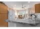 Open-concept kitchen flows into breakfast nook with large windows offering natural light at 11034 E Natal Ave, Mesa, AZ 85209