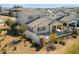 Aerial view of a backyard oasis with a covered patio, outdoor kitchen, fenced-in pool, and desert landscaping at 11172 N San Clemente St, Surprise, AZ 85388