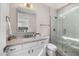 The bathroom boasts a glass-enclosed shower and a stylish vanity, creating a luxurious experience at 11172 N San Clemente St, Surprise, AZ 85388