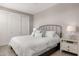 This bedroom features a minimalist design with a wrought-iron bed frame and neutral tones for a tranquil ambiance at 11172 N San Clemente St, Surprise, AZ 85388