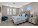 This bedroom features a tufted headboard and a charming blue-themed decor, promoting a relaxing atmosphere at 11172 N San Clemente St, Surprise, AZ 85388