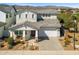 Beautiful two-story home with a well-maintained front yard, stylish gray roof, and attached two car garage at 11172 N San Clemente St, Surprise, AZ 85388