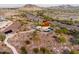 Panoramic aerial view of a desert community park featuring walking trails and unique architecture at 11182 S Hopi Dr, Goodyear, AZ 85338