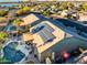 Stunning aerial view of backyard featuring a beautiful pool and solar panels on the roof at 11182 S Hopi Dr, Goodyear, AZ 85338
