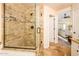 Bathroom features a beautiful tiled shower and a view into the bedroom, creating a relaxing space at 11182 S Hopi Dr, Goodyear, AZ 85338