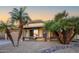 Well-maintained home with mature palm trees, desert landscaping, and a welcoming entrance at 11182 S Hopi Dr, Goodyear, AZ 85338