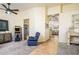 This living room has a large doorway leading to the kitchen and boasts carpet and tile flooring at 11182 S Hopi Dr, Goodyear, AZ 85338