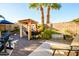 Outdoor space with a grill, flower planter and wooden pergola, creating an ideal space for relaxing at 11182 S Hopi Dr, Goodyear, AZ 85338