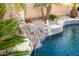 A rock waterfall feature enhances the backyard swimming pool at 11182 S Hopi Dr, Goodyear, AZ 85338