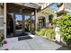 Welcoming building entrance with glass doors and lush landscaping at 11640 N Tatum Blvd # 3069, Phoenix, AZ 85028