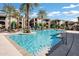 Enjoy the community pool surrounded by tall palm trees, with a nice view of the condos behind it at 11640 N Tatum Blvd # 3069, Phoenix, AZ 85028