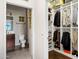 A glimpse of the walk-in closet with the bathroom across the hallway at 11640 N Tatum Blvd # 3069, Phoenix, AZ 85028