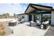 A lovely patio with desert landscaping, modern seating, and sleek contemporary design elements, perfect for entertaining guests at 12201 N 65Th St, Scottsdale, AZ 85254