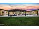 Beautiful backyard featuring a covered patio with stylish outdoor furniture, perfect for relaxing and enjoying the sunset at 12201 N 65Th St, Scottsdale, AZ 85254
