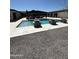 Expansive backyard featuring a modern pool, pergola, and gravel landscaping, ideal for outdoor living at 12201 N 65Th St, Scottsdale, AZ 85254
