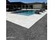 Beautiful backyard with a modern pool, patio, and pergola, perfect for outdoor entertaining and relaxation at 12201 N 65Th St, Scottsdale, AZ 85254
