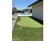 Lush backyard featuring a putting green, pool, and manicured landscaping for recreational enjoyment at 12201 N 65Th St, Scottsdale, AZ 85254