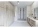 Spacious bathroom featuring a walk-in shower, double vanity, and ample storage space at 12201 N 65Th St, Scottsdale, AZ 85254