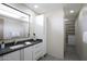 Well-appointed bathroom featuring a modern vanity, ample storage, and access to a spacious walk-in closet at 12201 N 65Th St, Scottsdale, AZ 85254