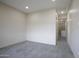 Spacious bedroom with recessed lighting and neutral walls, with a connecting hallway and a walk-in closet at 12201 N 65Th St, Scottsdale, AZ 85254