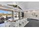 Airy dining room with vaulted ceiling, modern furniture, and seamless access to outdoor living at 12201 N 65Th St, Scottsdale, AZ 85254