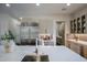 Well-lit kitchen with stainless steel refrigerator, ample counter space, and stylish cabinetry at 12201 N 65Th St, Scottsdale, AZ 85254