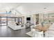 Open-concept living space featuring modern fireplace, dining area, and easy outdoor access at 12201 N 65Th St, Scottsdale, AZ 85254