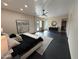 Large main bedroom featuring modern decor, ample lighting, and a view of the backyard through the sliding glass door at 12201 N 65Th St, Scottsdale, AZ 85254