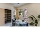 Bright office showcases a glass desk, stylish chair, and views to the outdoors, perfect for a productive workspace at 12201 N 65Th St, Scottsdale, AZ 85254