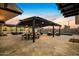 Expansive outdoor patio with pergola, dining area, and multiple seating areas perfect for entertaining at 12201 N 65Th St, Scottsdale, AZ 85254