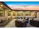 Outdoor patio featuring stylish wicker seating around a central coffee table, perfect for entertaining guests at 12201 N 65Th St, Scottsdale, AZ 85254