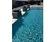 Refreshing pool with clear blue water and stylish water features, creating a luxurious backyard oasis at 12201 N 65Th St, Scottsdale, AZ 85254