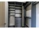 Spacious walk-in closet with adjustable shelving and drawers for organized storage at 12201 N 65Th St, Scottsdale, AZ 85254