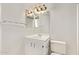 Simple bathroom features a vanity with storage and a standard toilet at 12221 W Bell Rd # 249, Surprise, AZ 85378