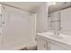 Bright bathroom featuring a shower and vanity with storage space at 12221 W Bell Rd # 249, Surprise, AZ 85378
