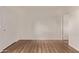 Clean bedroom with wood-look flooring and white walls provides ample space at 12221 W Bell Rd # 249, Surprise, AZ 85378