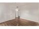 Spacious bedroom with wood flooring and a doorway leading to other rooms at 12221 W Bell Rd # 249, Surprise, AZ 85378