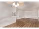 Spacious living room with wood floors, white walls, and an open floor plan at 12221 W Bell Rd # 249, Surprise, AZ 85378